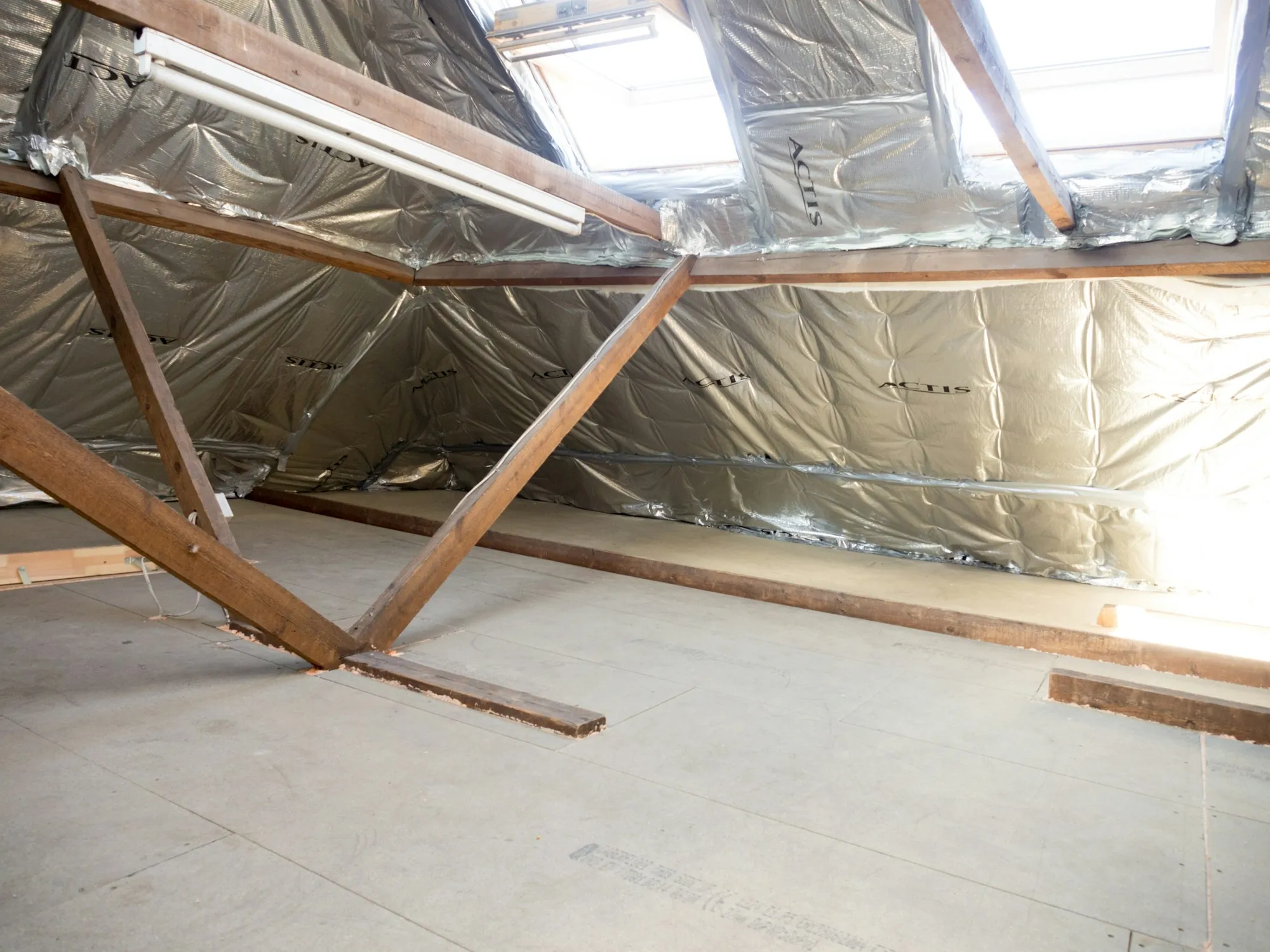 Attic with reflective insulation and diagonal wood bracing