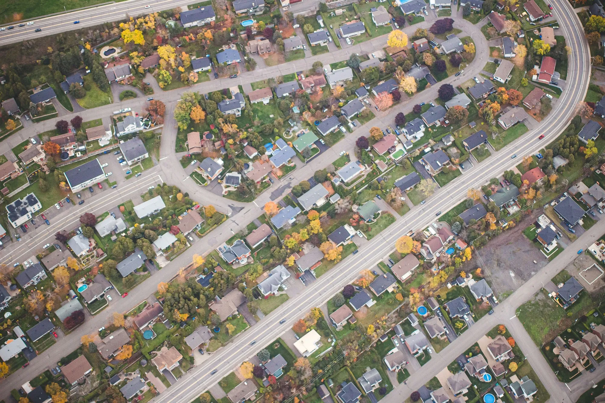 Aerial view of curving residential streets in a suburb
